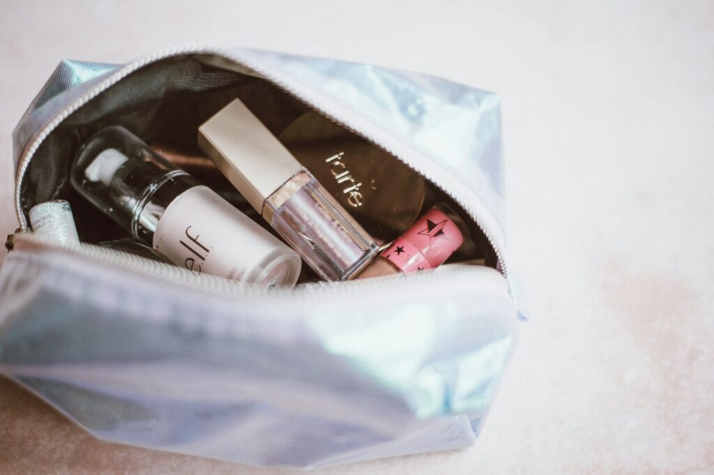 Toiletries and travel-size cosmetics packed in a bag for travel